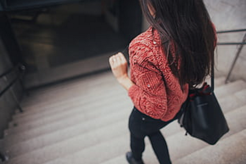 Woman with Black Purse Walking Downstairs Woman with Black Purse Walking Downstairs